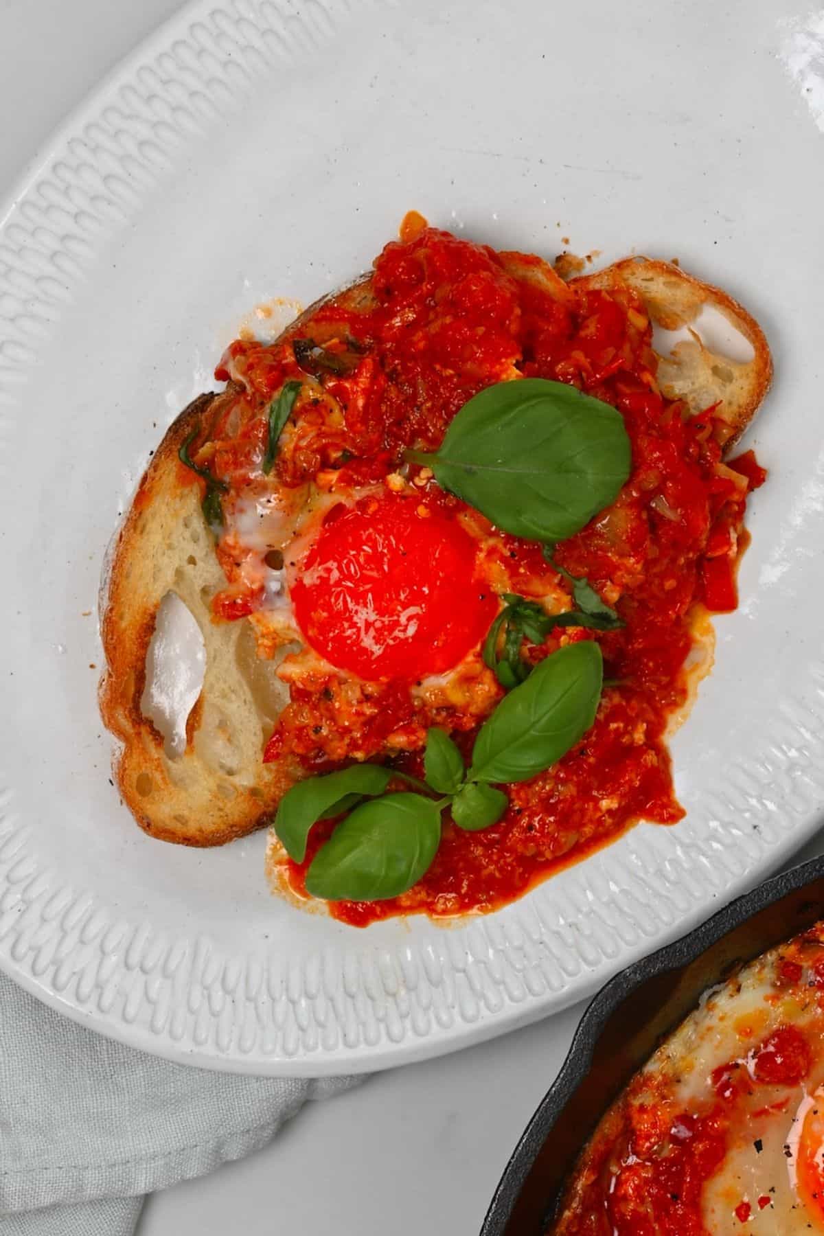 A serving of eggs in purgatory over toast