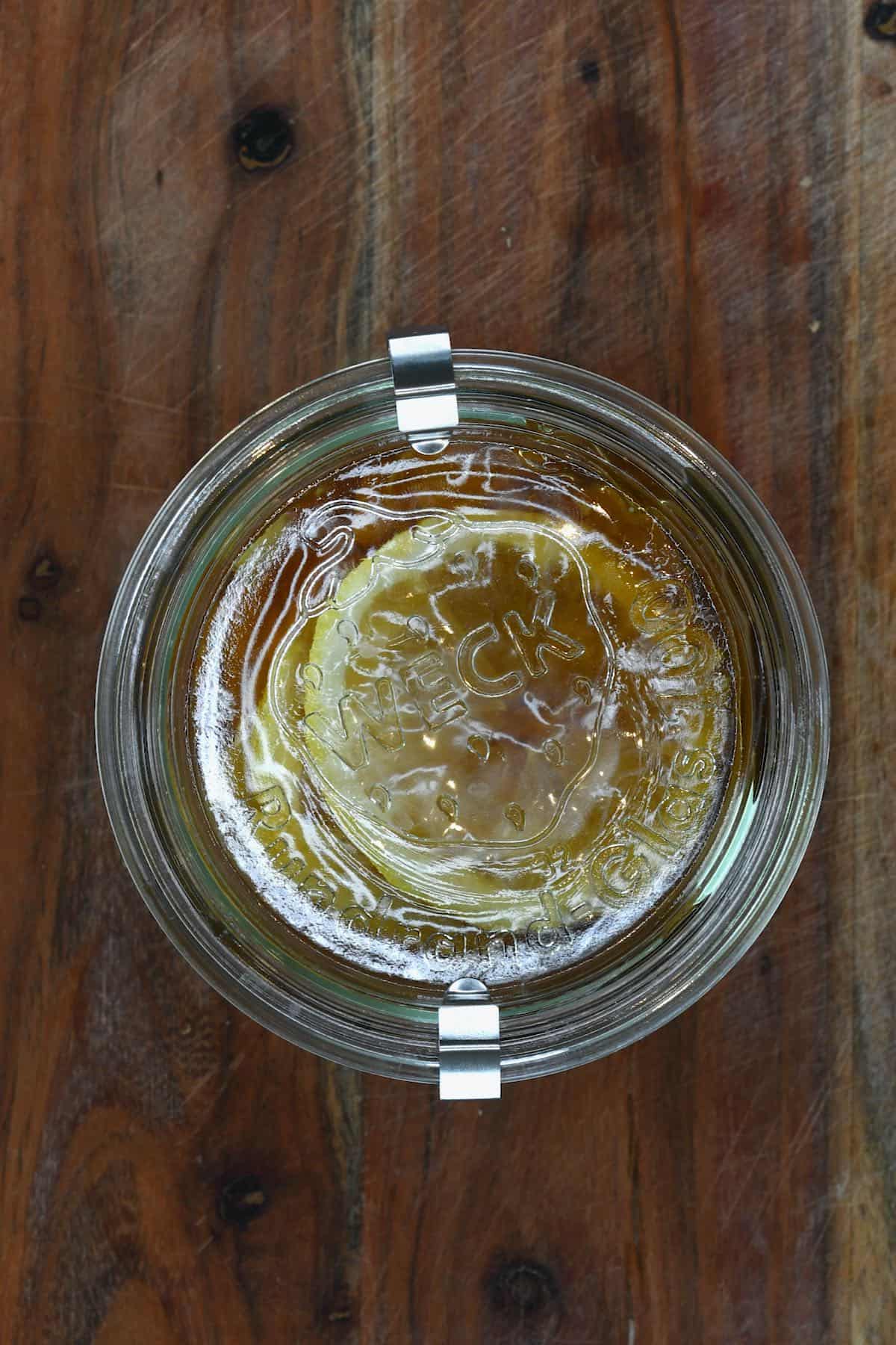 A closed jar with honey fermented lemon and ginger