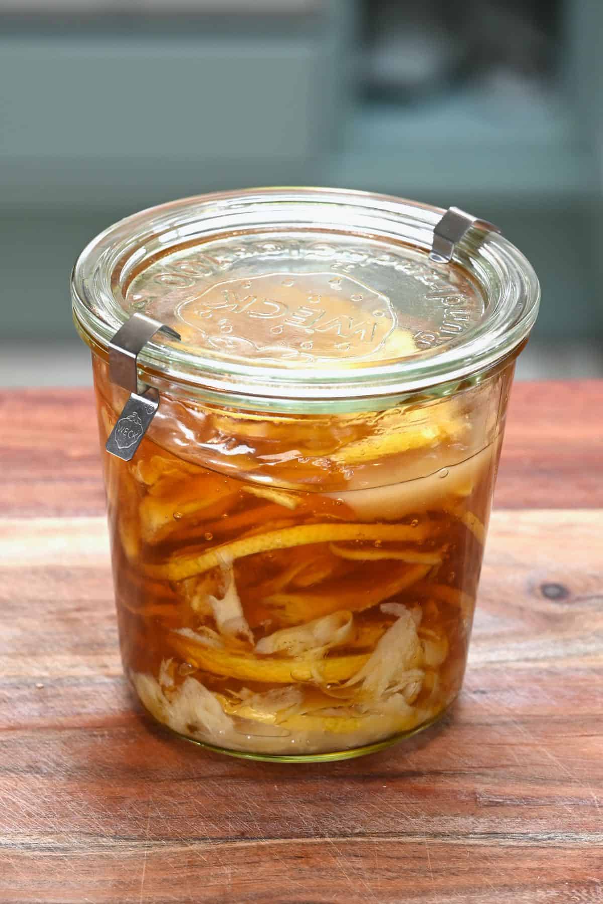 A jar with fermented lemon ginger honey