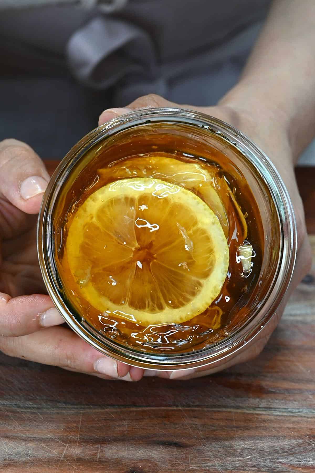 A jar with honey and lemon