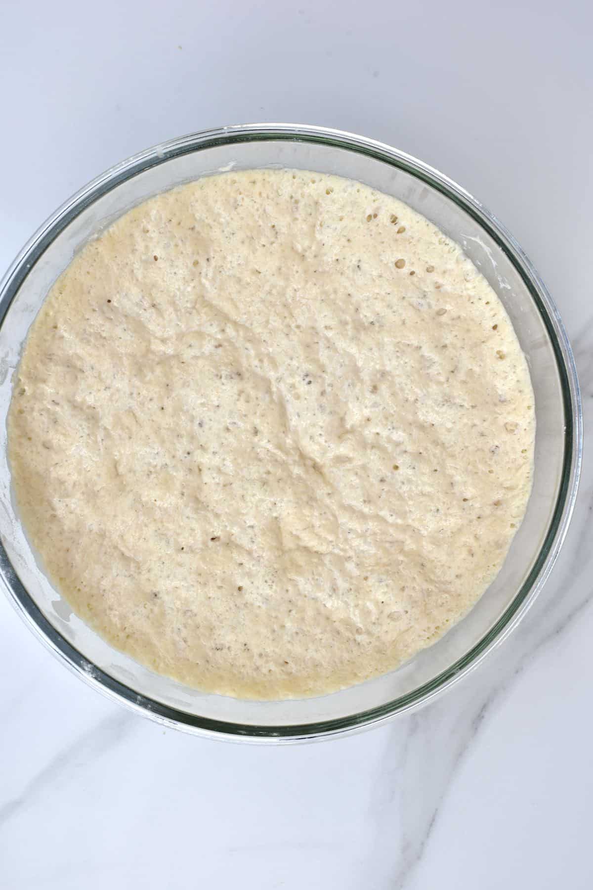 Risen bread dough in a bowl
