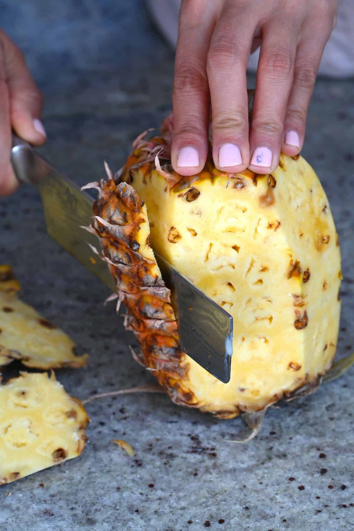 Peeling a pineapple