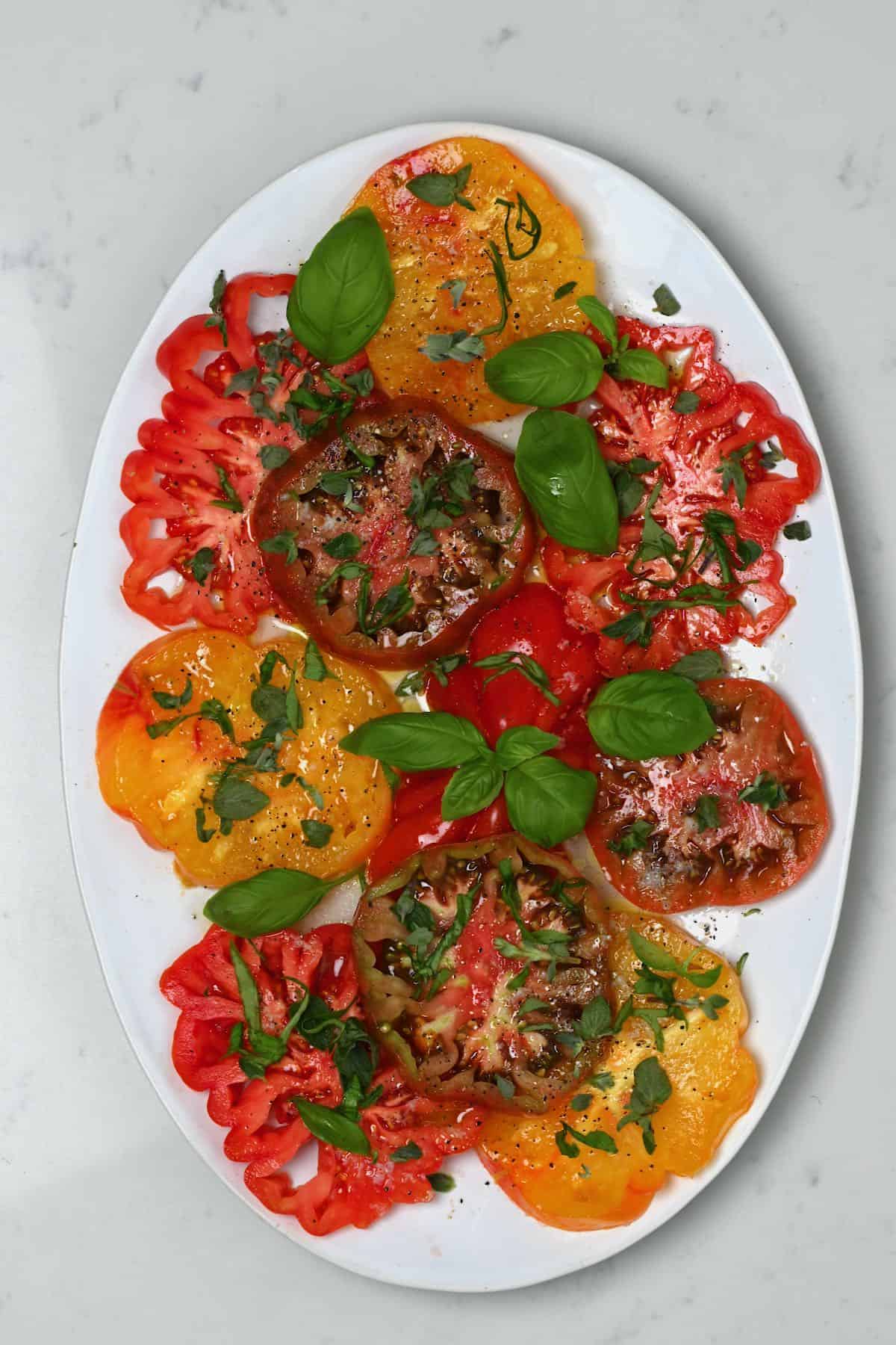 Tomato salad topped with basil
