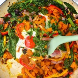 sweet potato hash in a pan with egg
