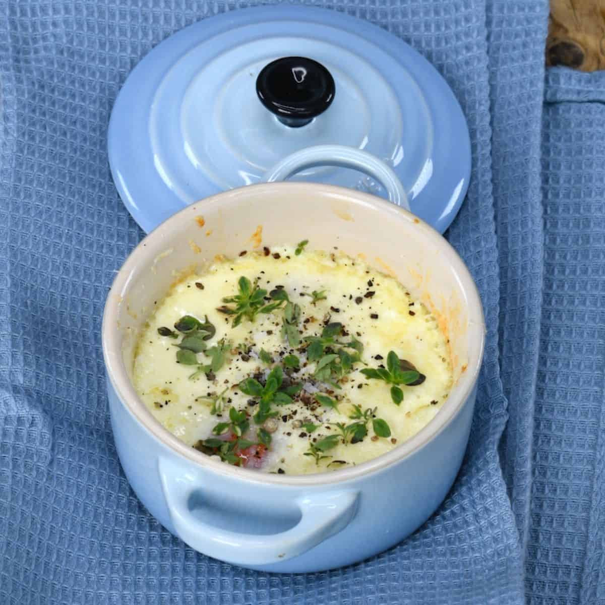 French baked eggs topped with herbs