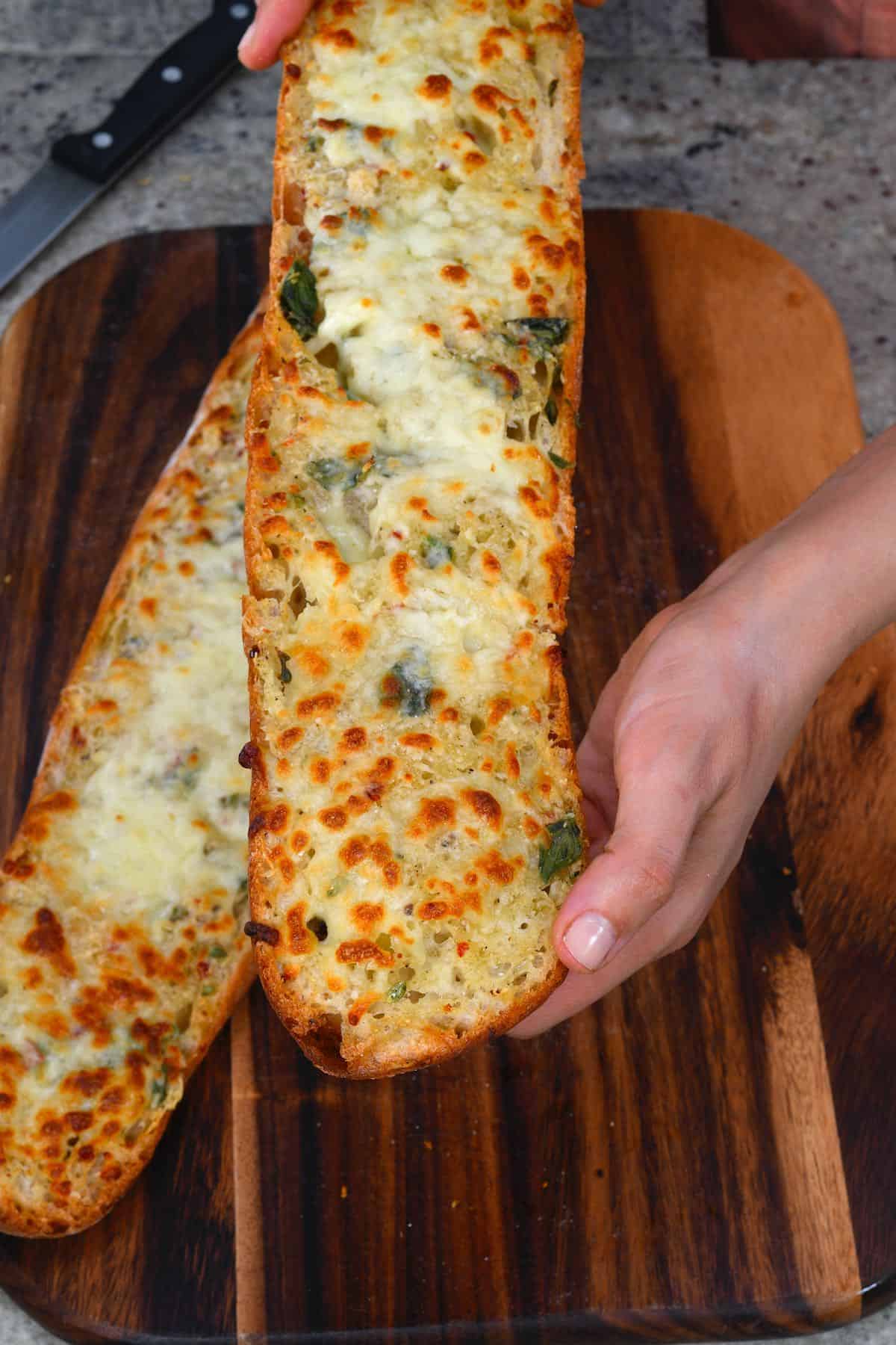 A large piece of garlic bread