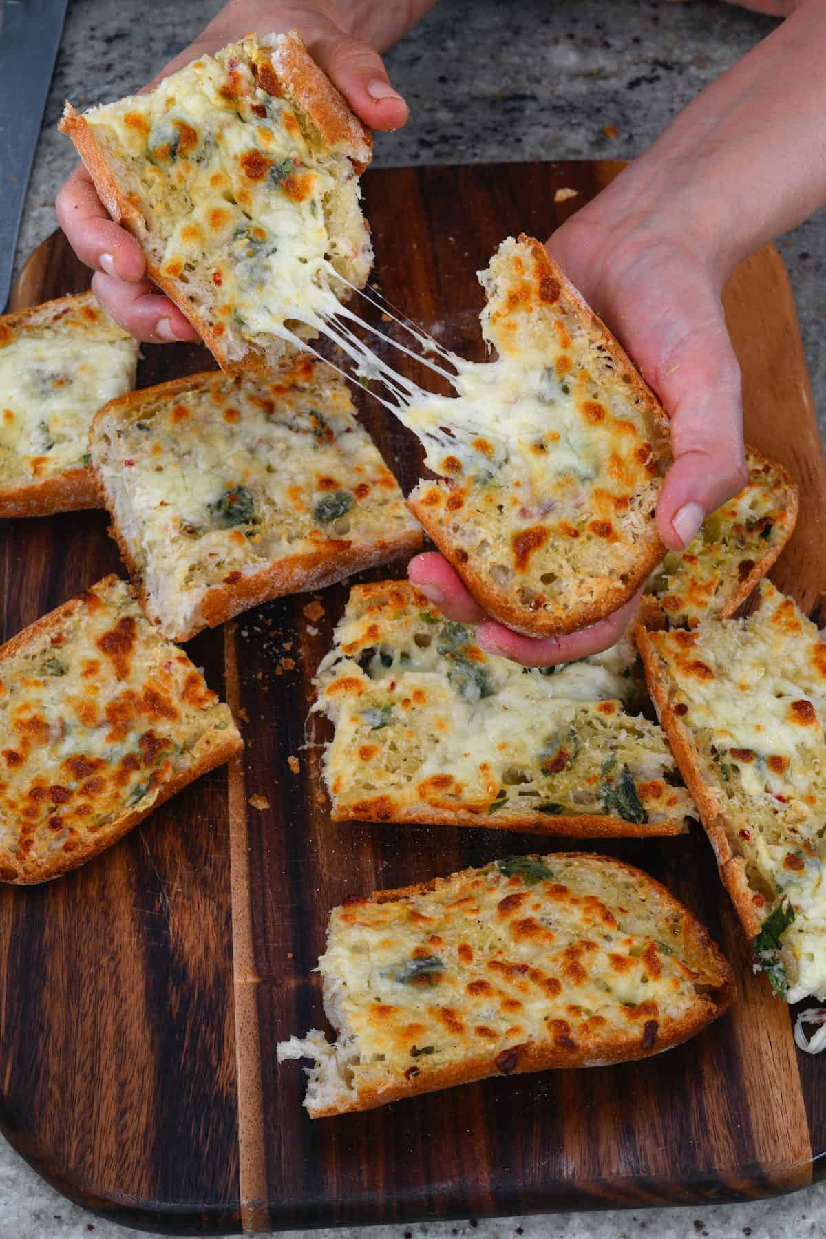 Cutting cheesy garlic bread