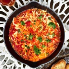 Menemen in a pan with bread and tea