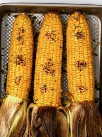 Oven-roasted corn in a tray