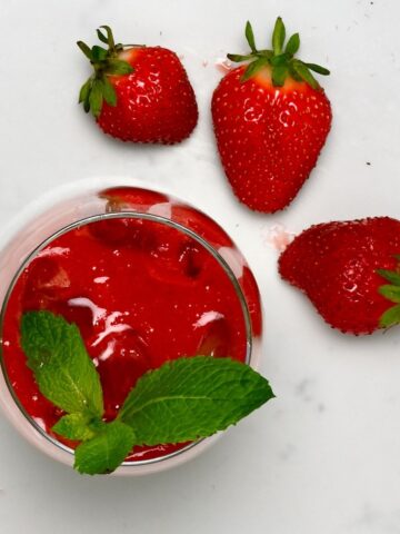 A glass with strawberry juice
