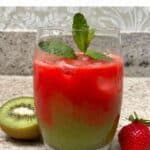 A glass with strawberry and kiwi juice