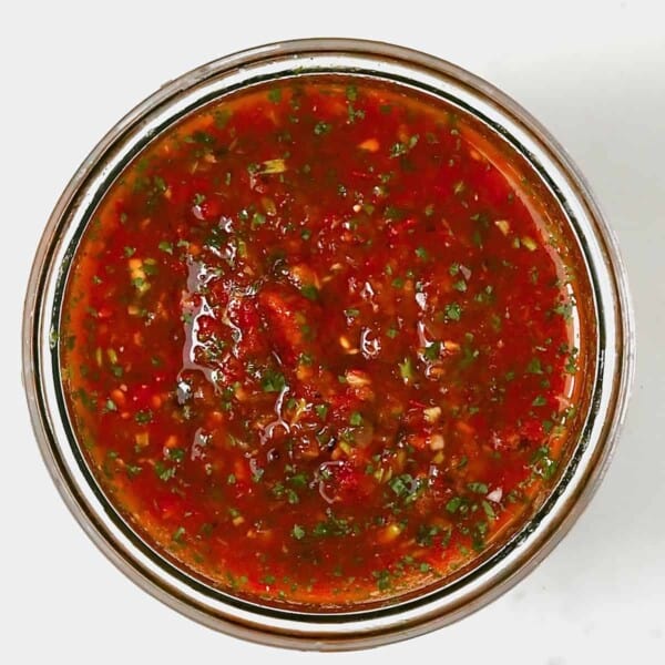 A jar with roasted tomato salsa