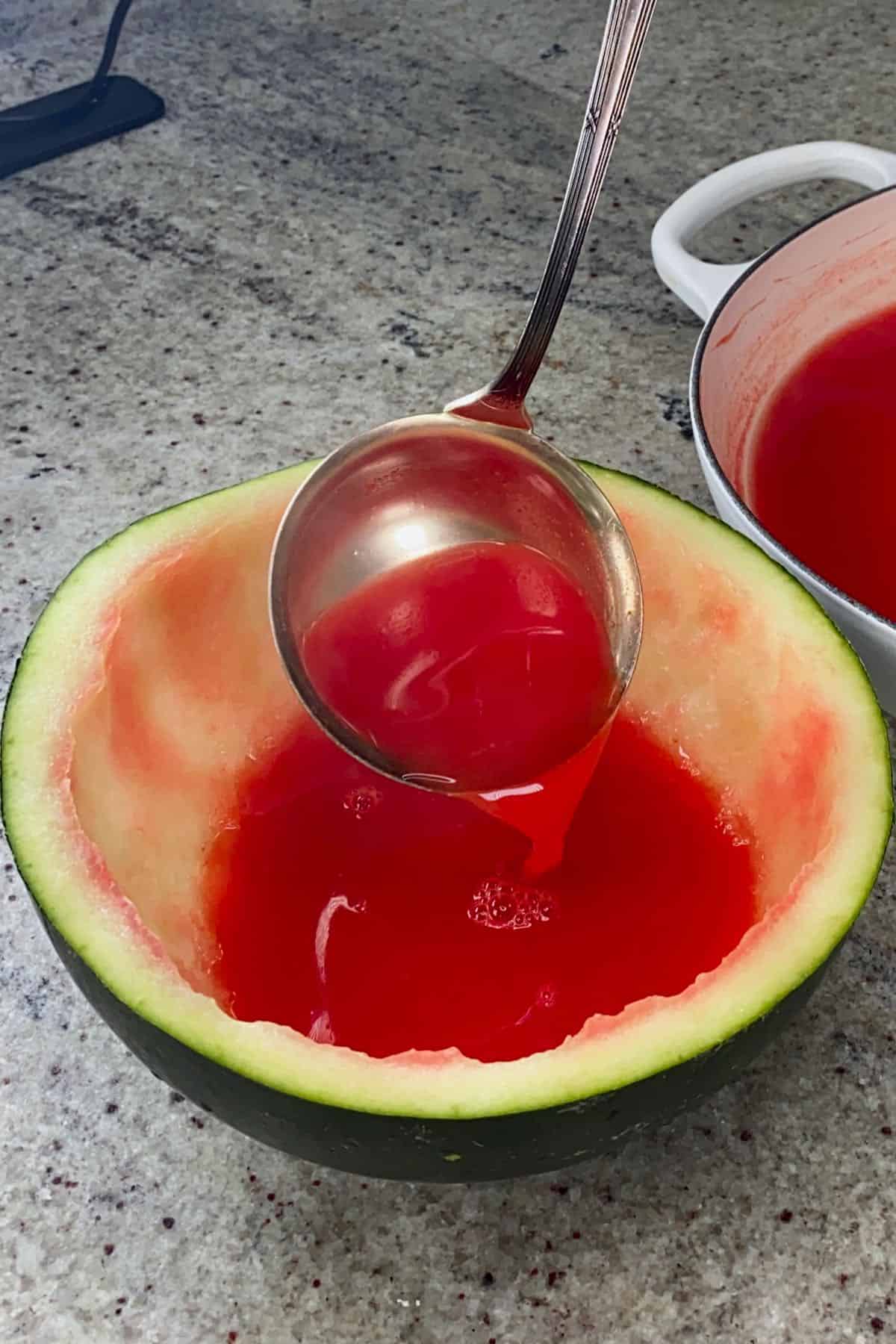Pouring watermelon juice in a rind