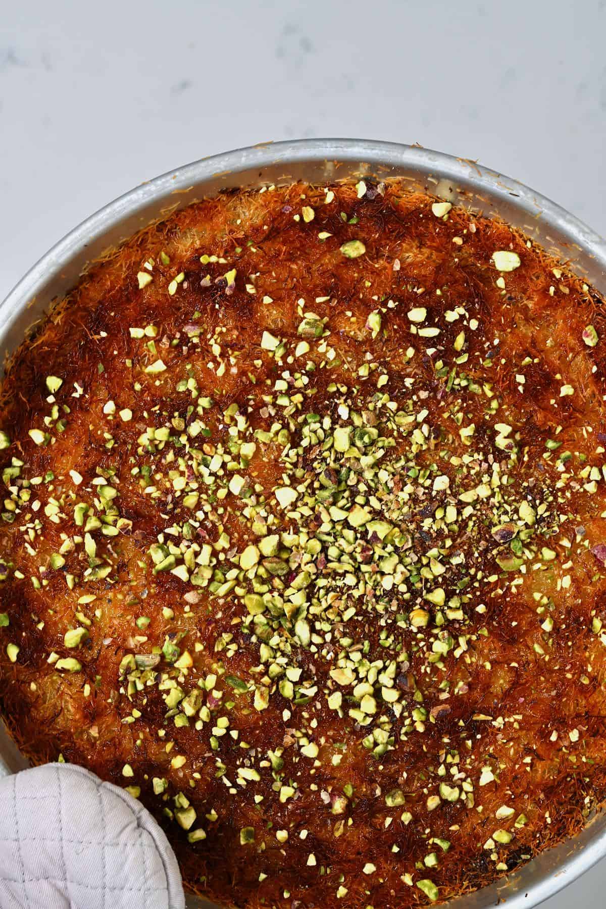 Homemade cheese kunafa topped with pistachios