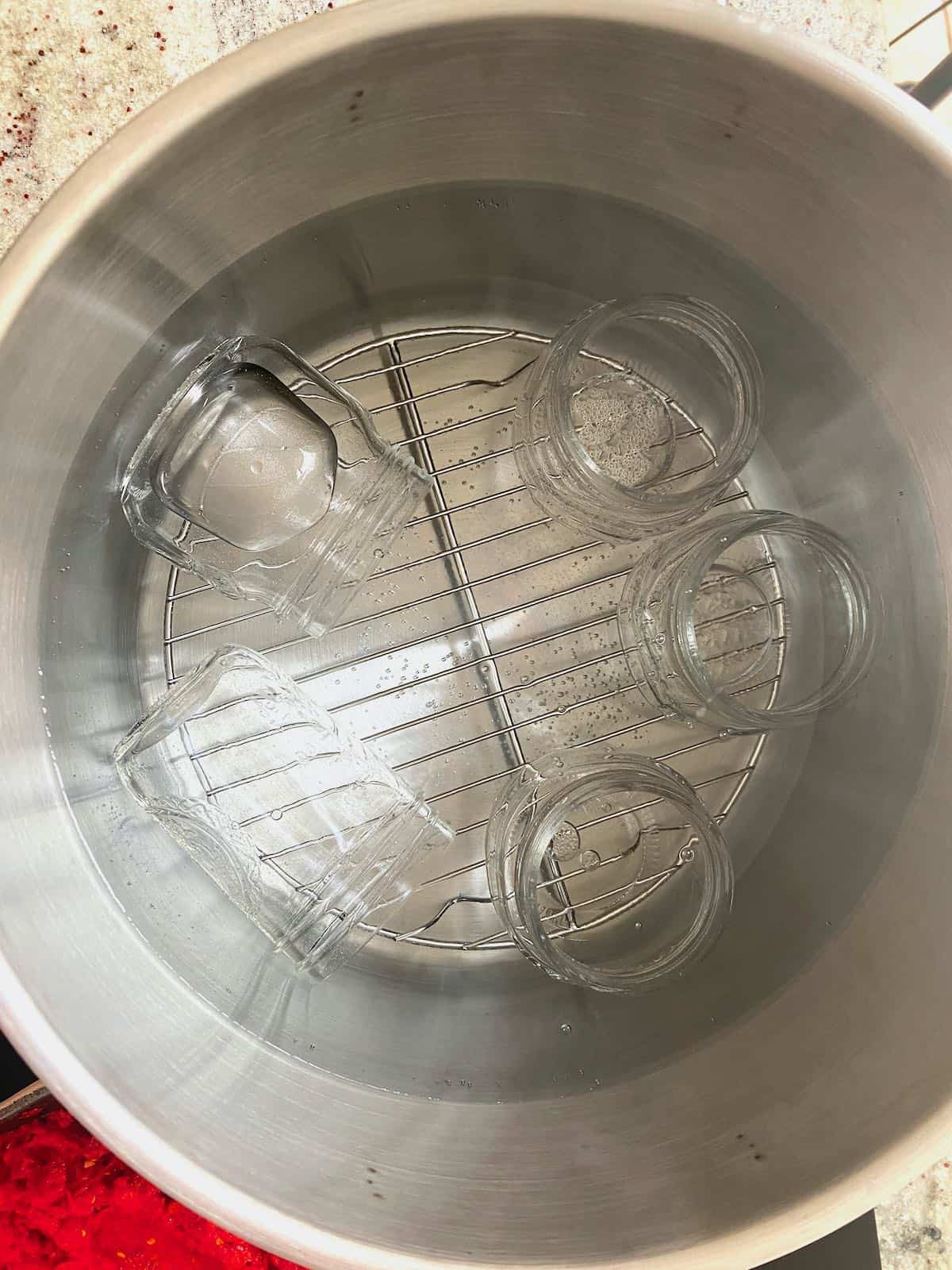 Clean jars in hot water in a large pot