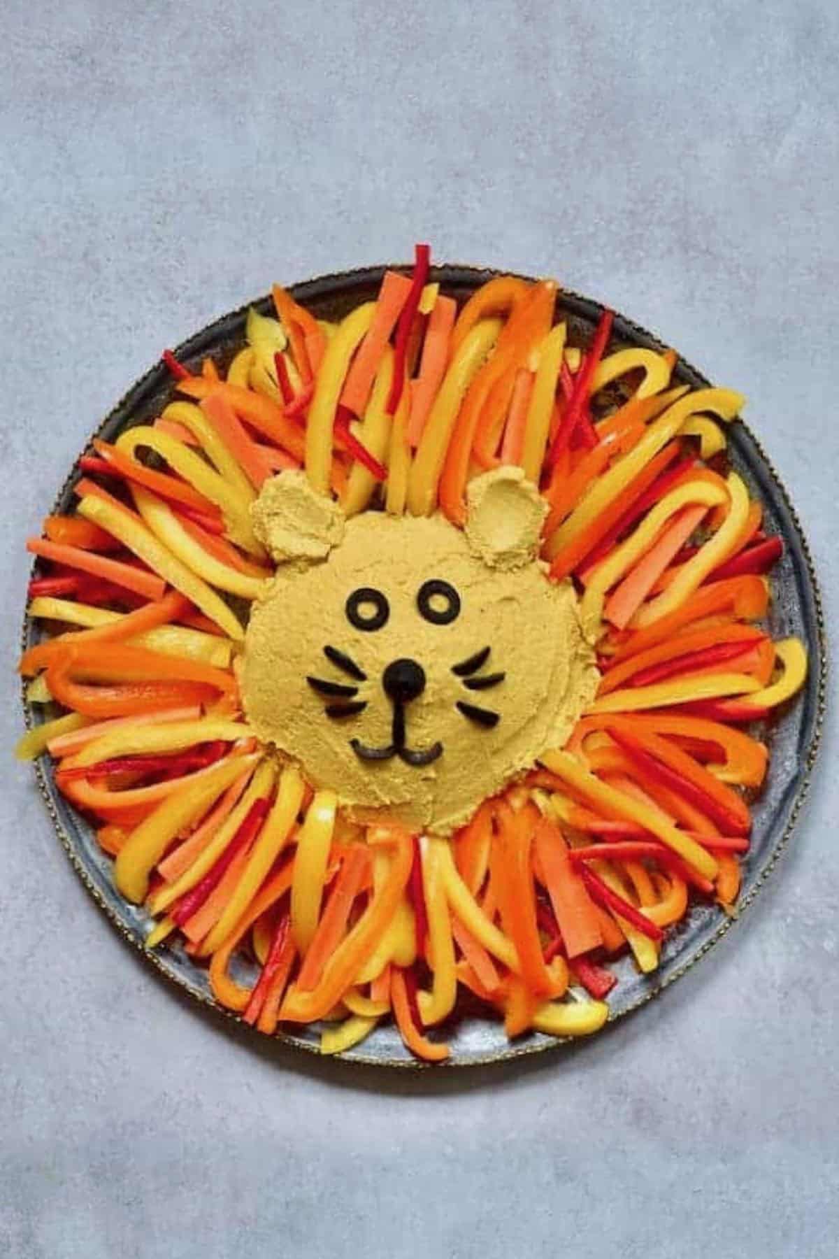 Pumpkin spiced hummus shaped as lion