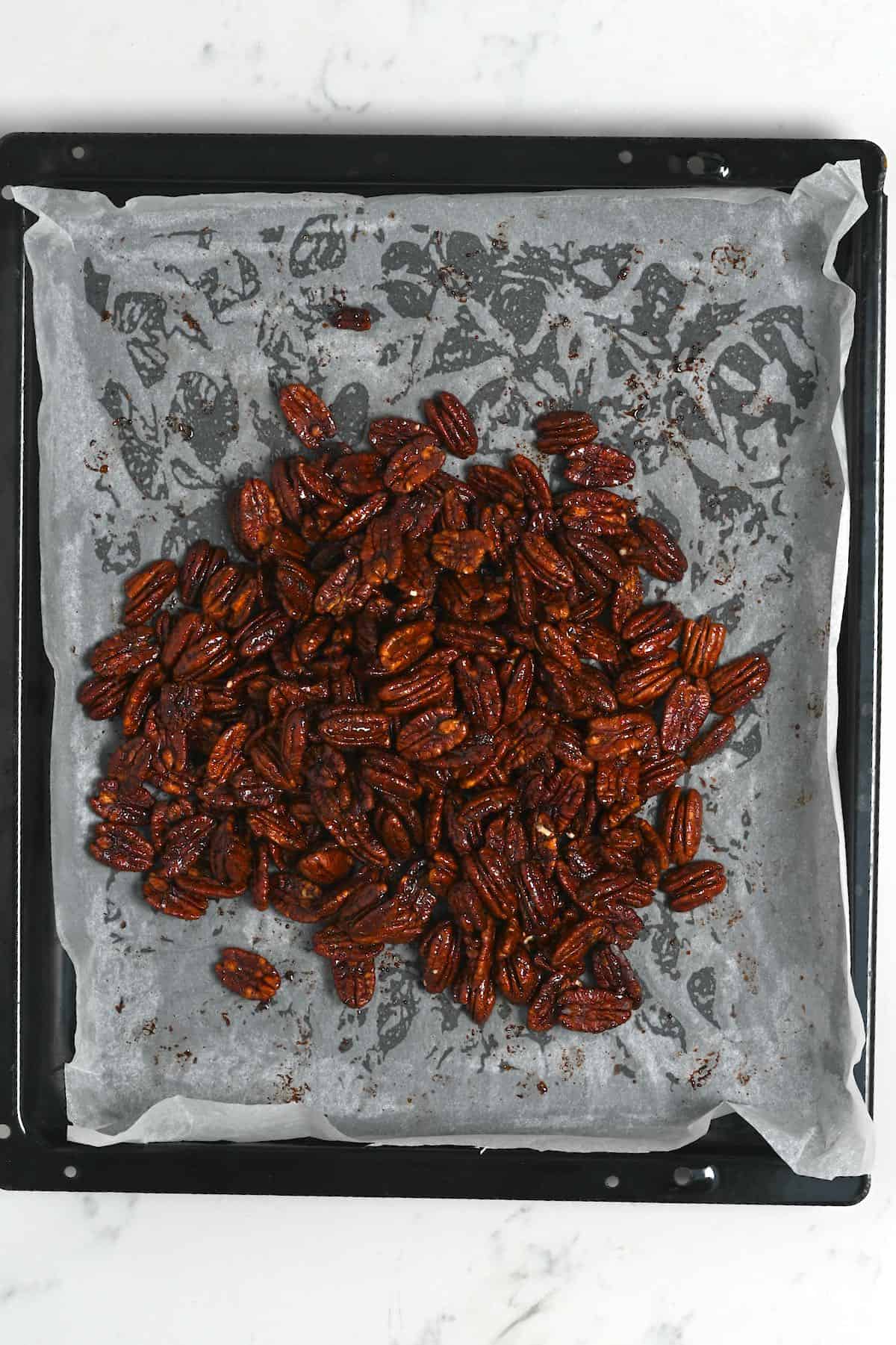 Candied pecans on a baking tray