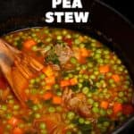 A saucepan with carrot and pea stew