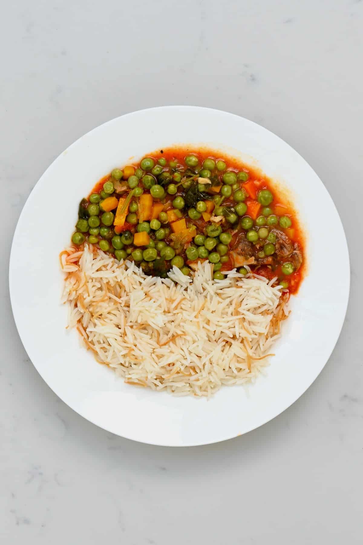 A serving of carrot pea stew and rice
