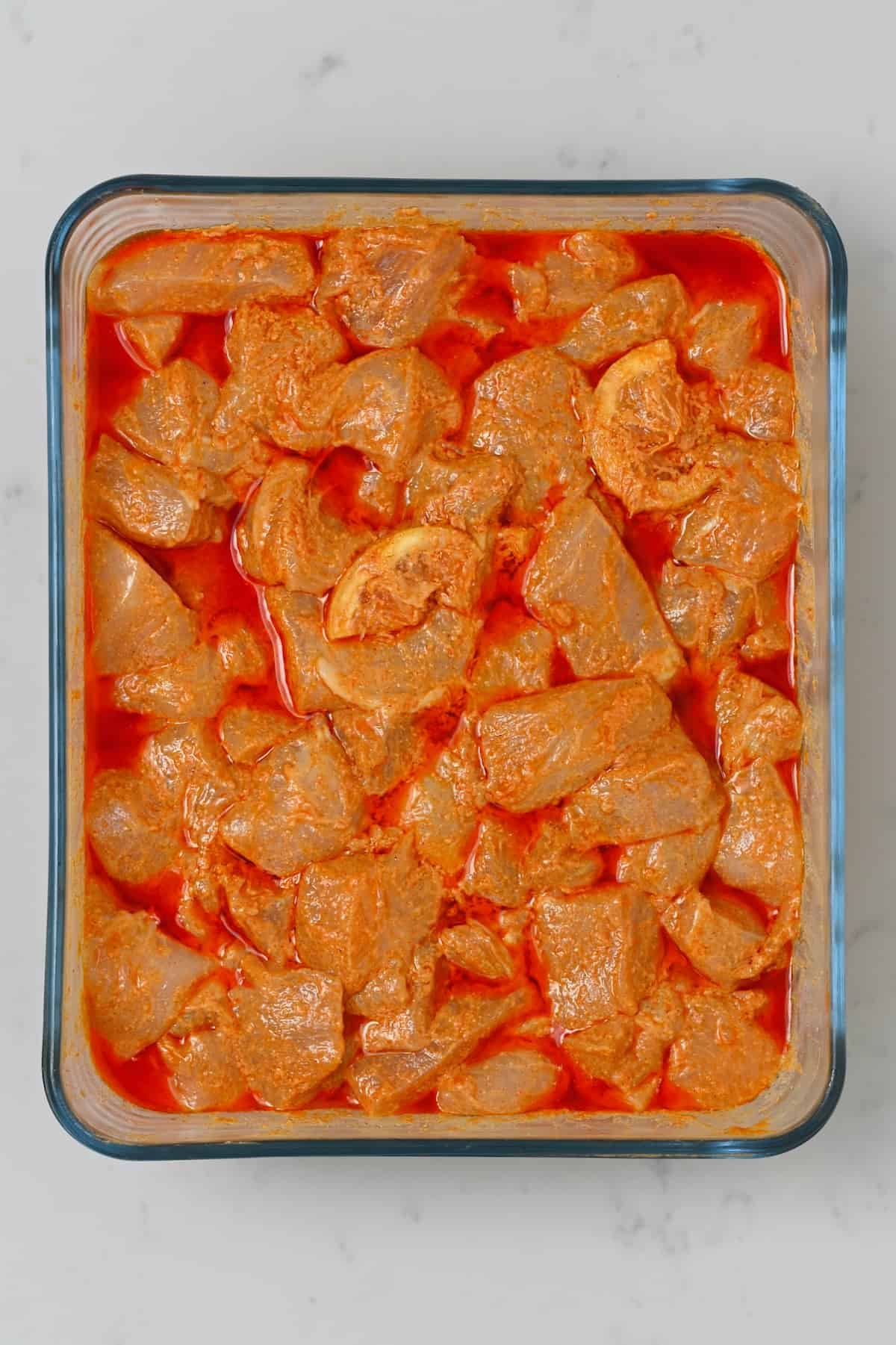 Marinating chicken in a square container