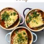 Three bowls with french onion soup topped with melted cheese