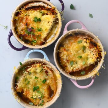 Three bowls with French Onion Soup