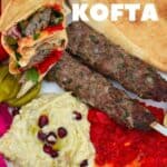 A platter with kofta skewers and dips