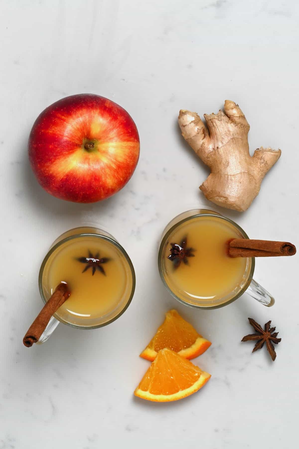 Two glasses with spiced apple cider