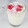 square photo of white hot chocolate in a glass mug