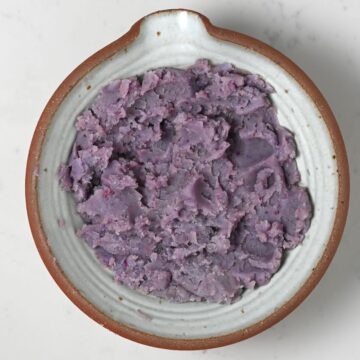 Mashed purple potatoes in a bowl