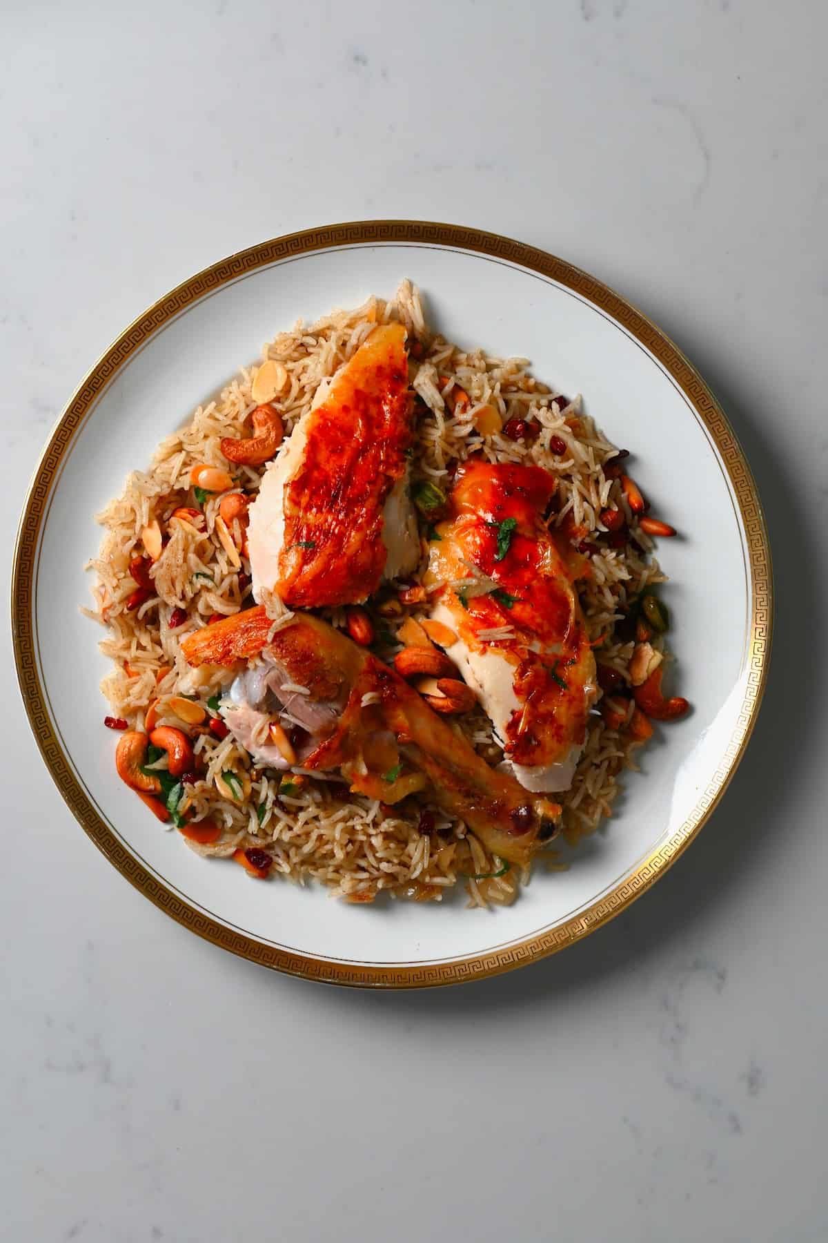 A serving of rice and roasted chicken