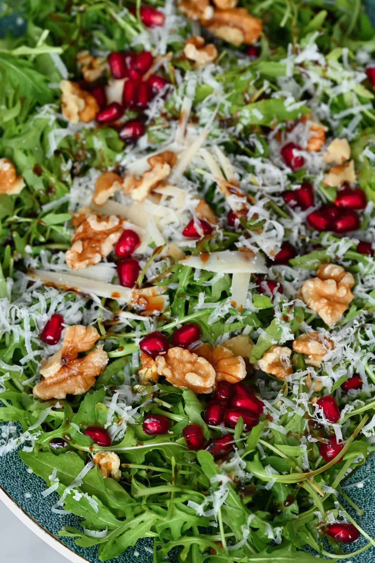 A close up of arugula and parmesan salad