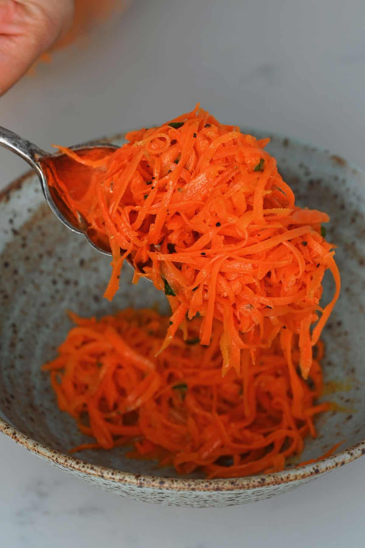 Serving carrot salad in a bowl