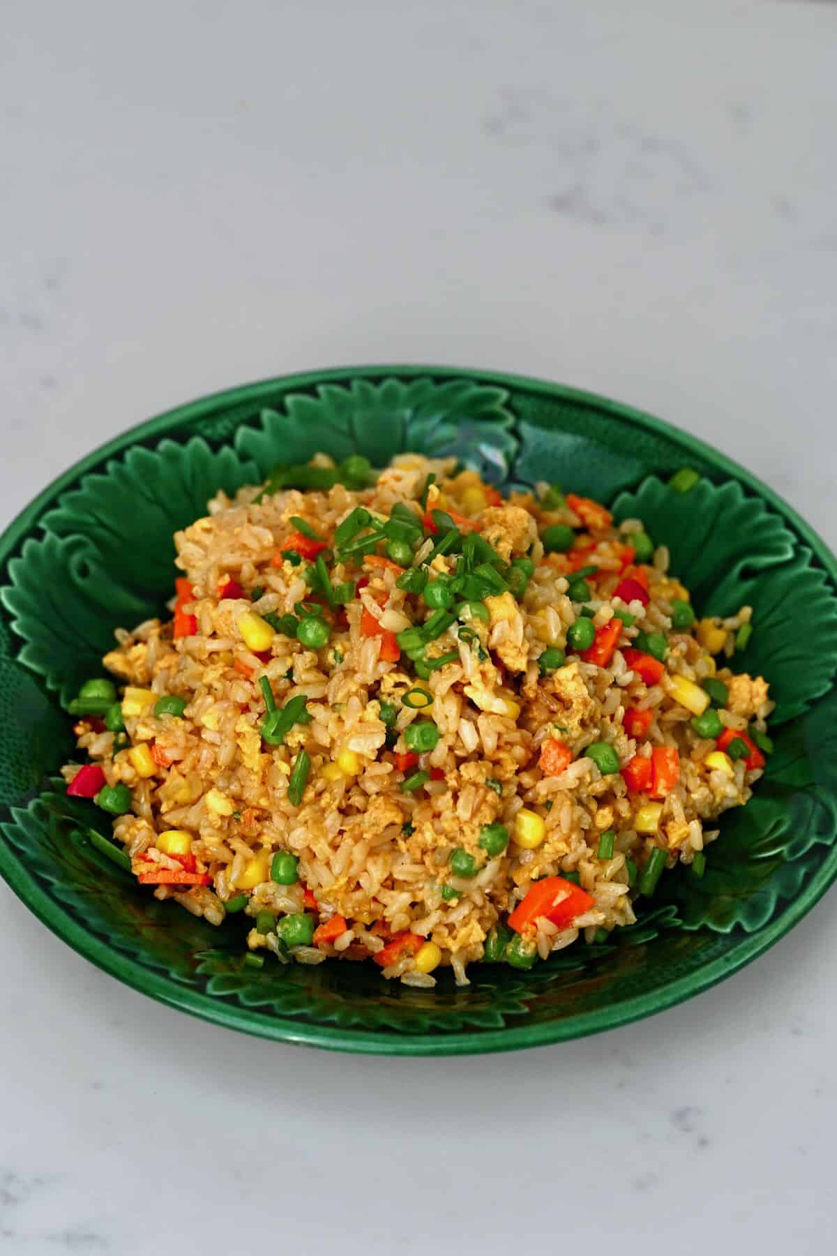 A bowl with egg fried rice