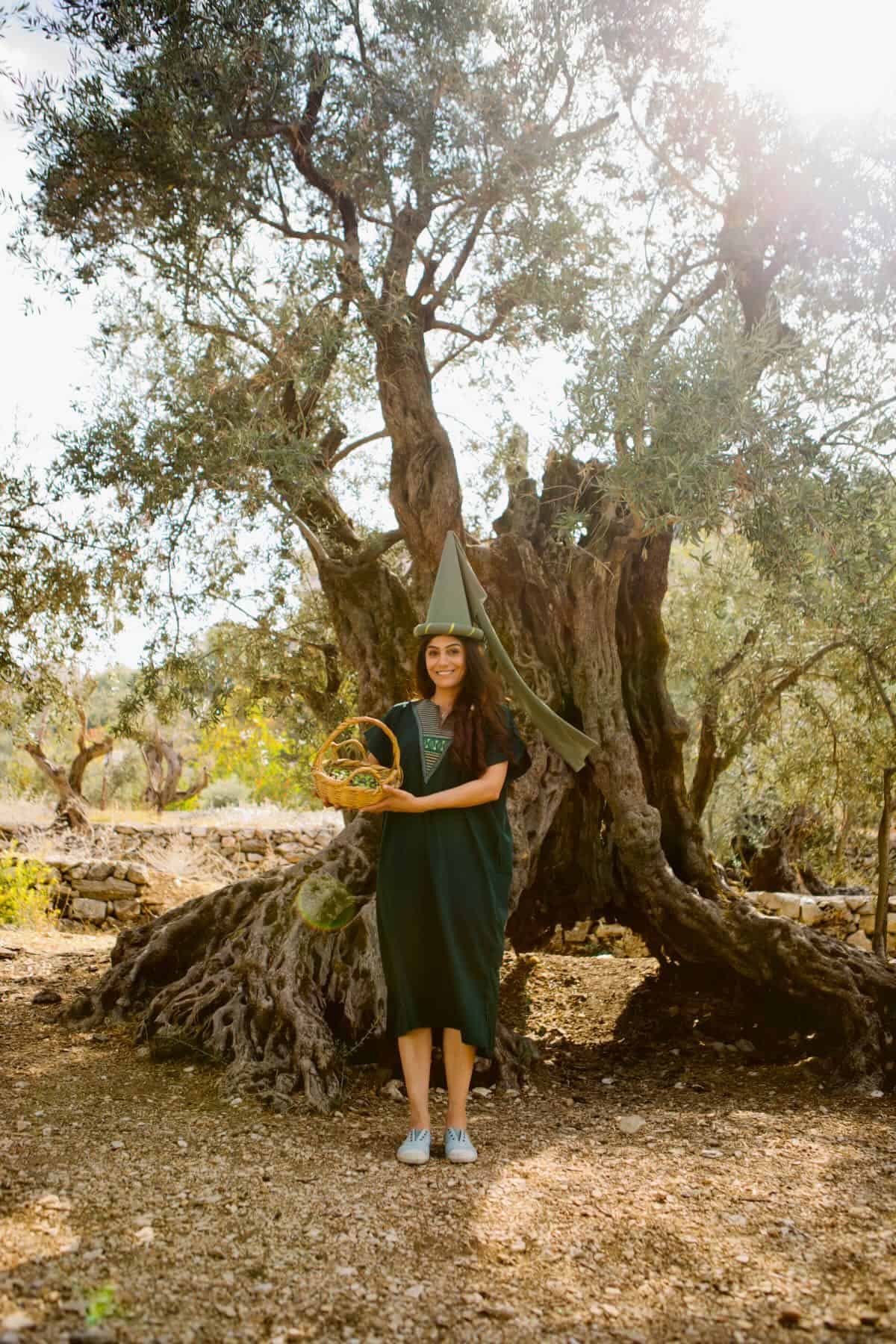 Samira in front of an olive tree