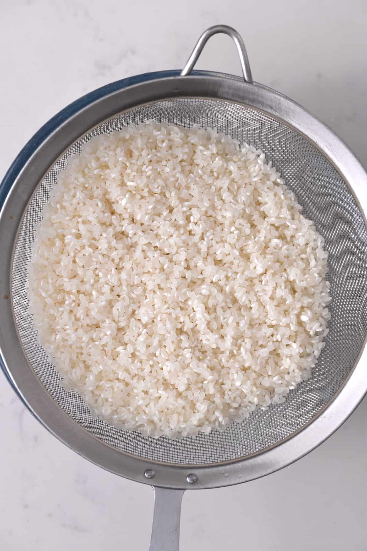 Rice draining in a strainer