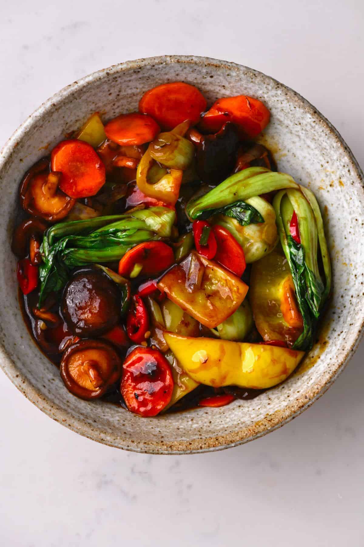 A bowl with vegetable stir fry