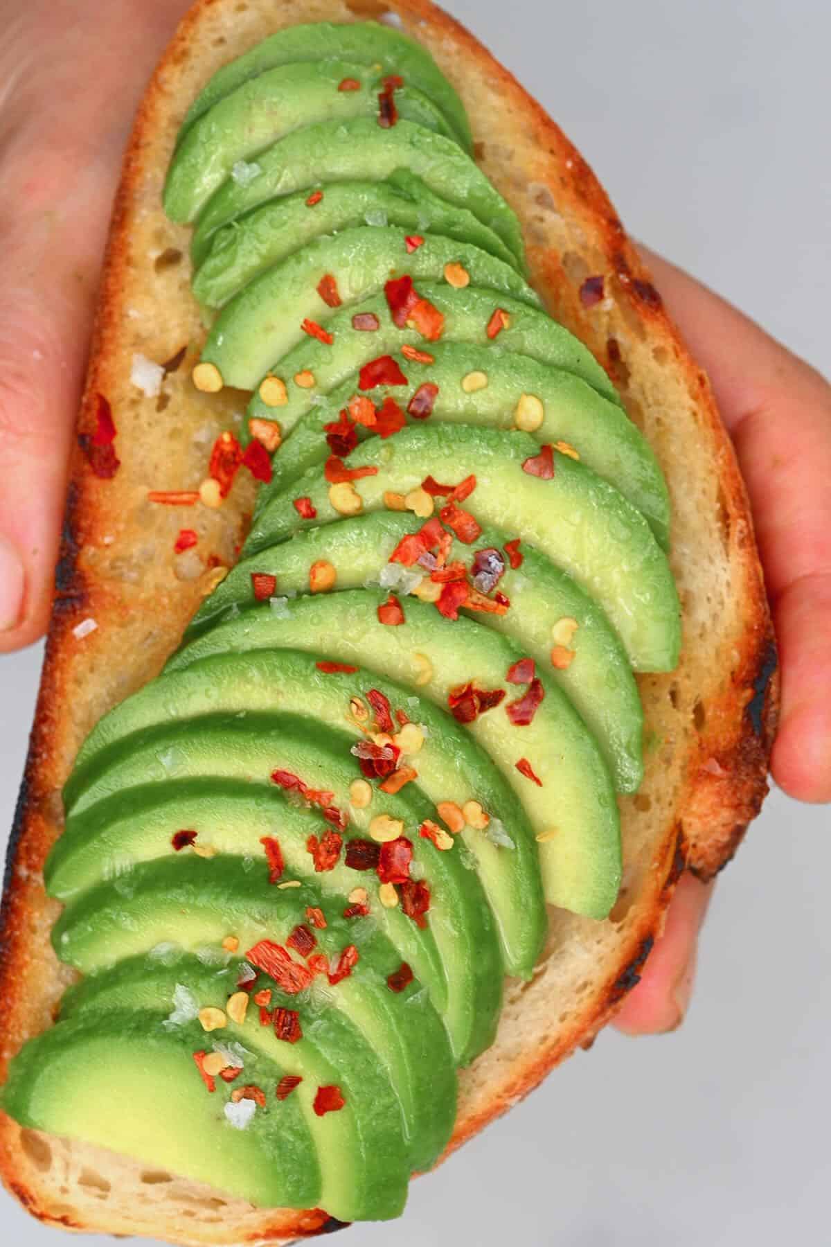 An avocado toast topped with chili flakes