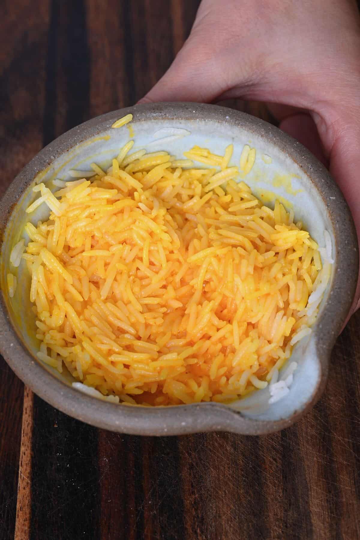 Mixing rice with yolk mixture