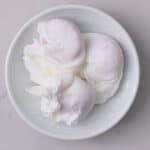 Three poached egsg in a small bowl - 14