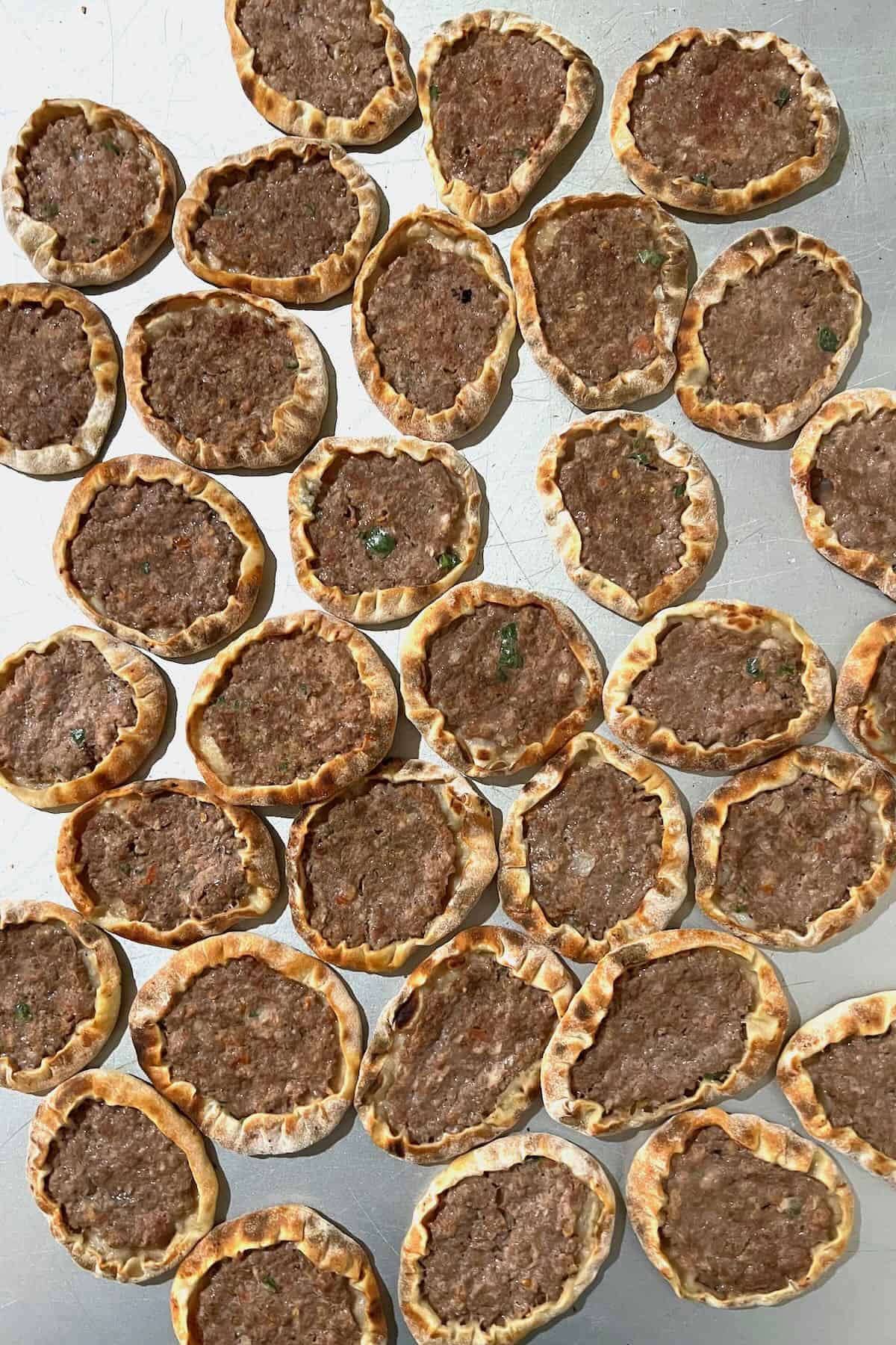 Sfiha meat pies on a flat surface