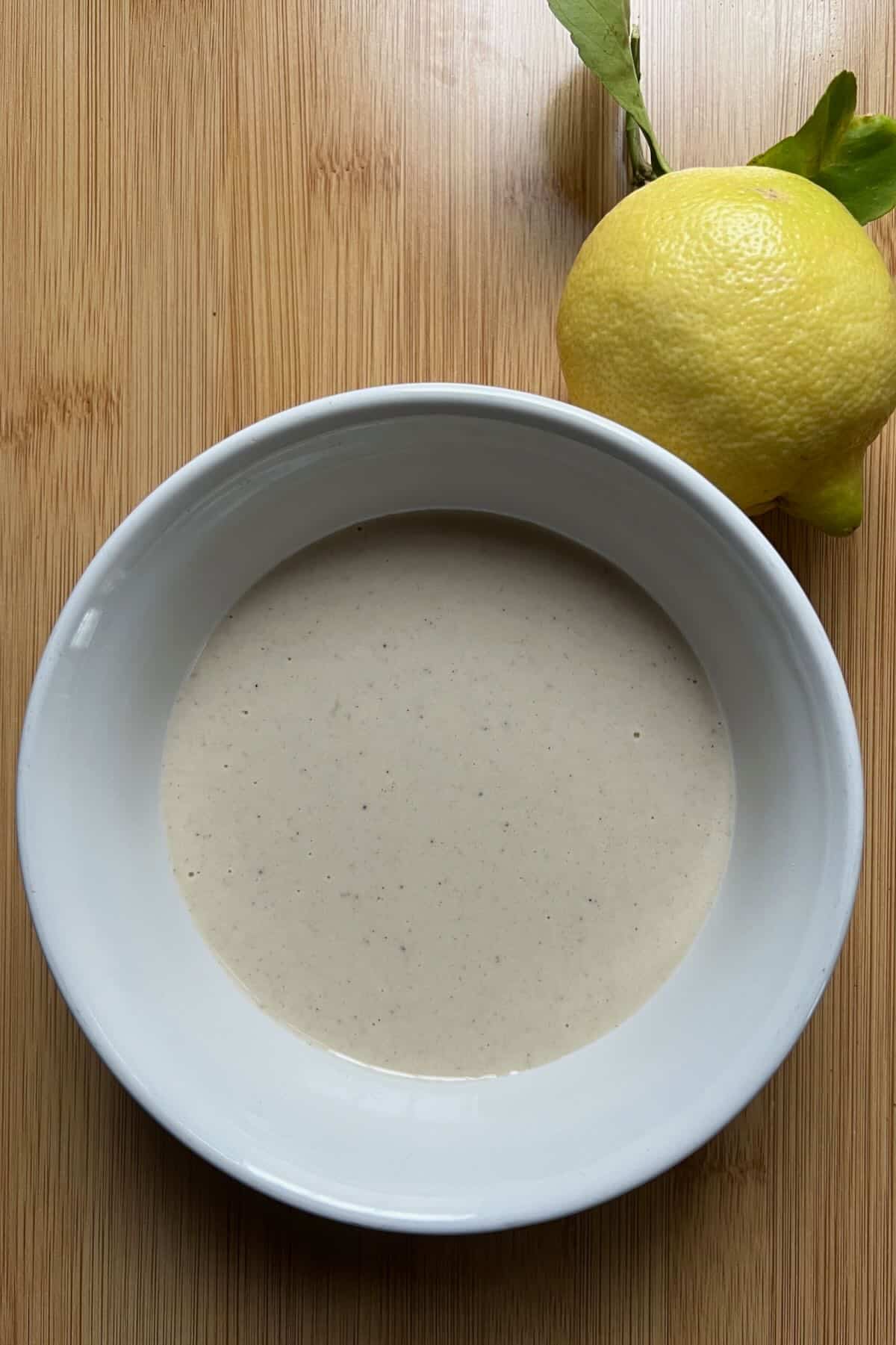 Lemon tahini sauce in a bowl