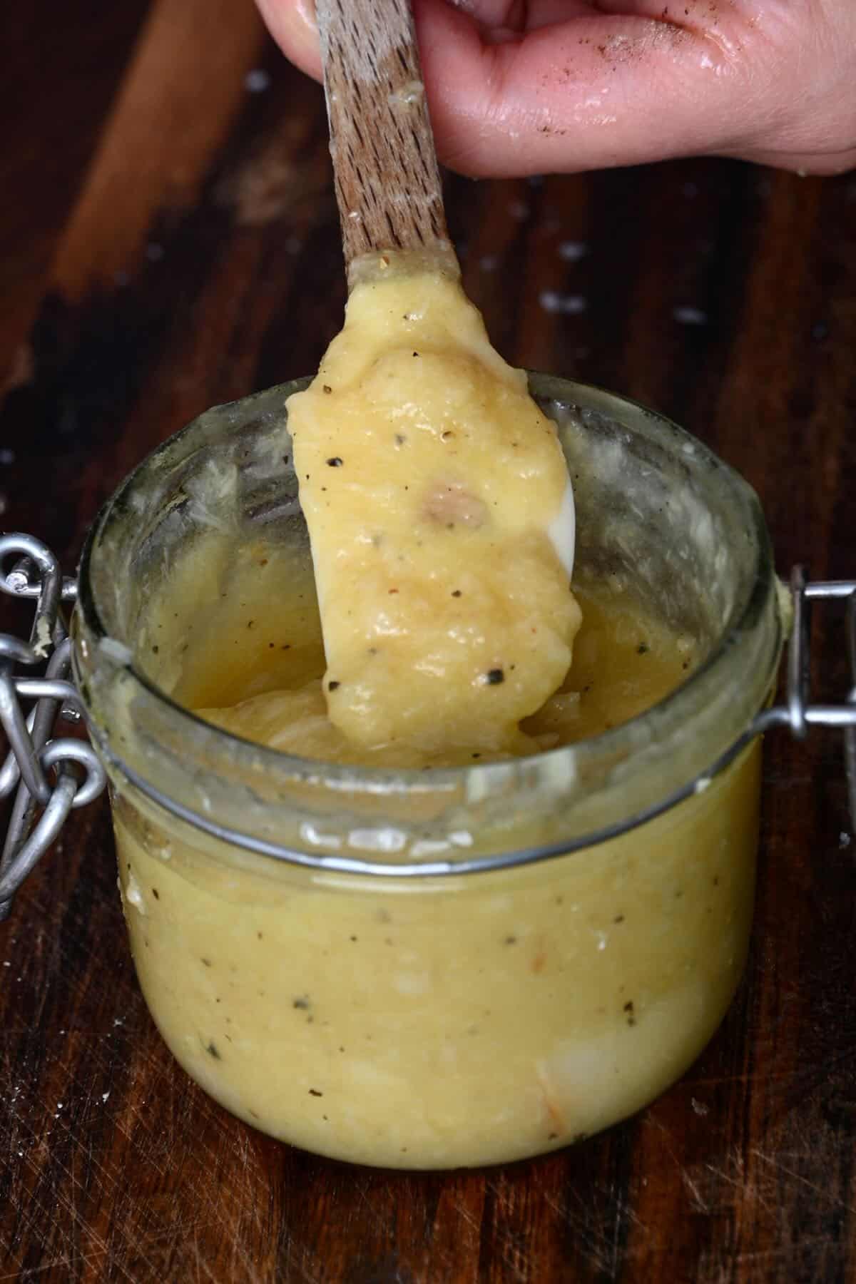 A spoonful of roasted garlic dressing
