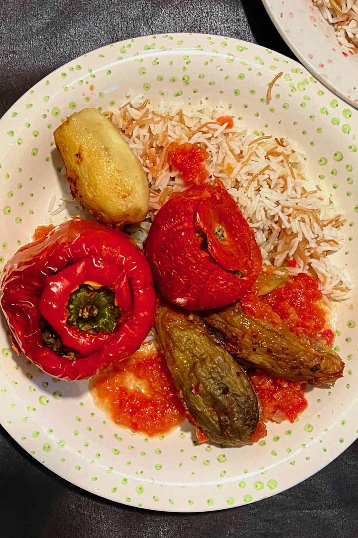 A serving of stuffed veggies with meat and rice