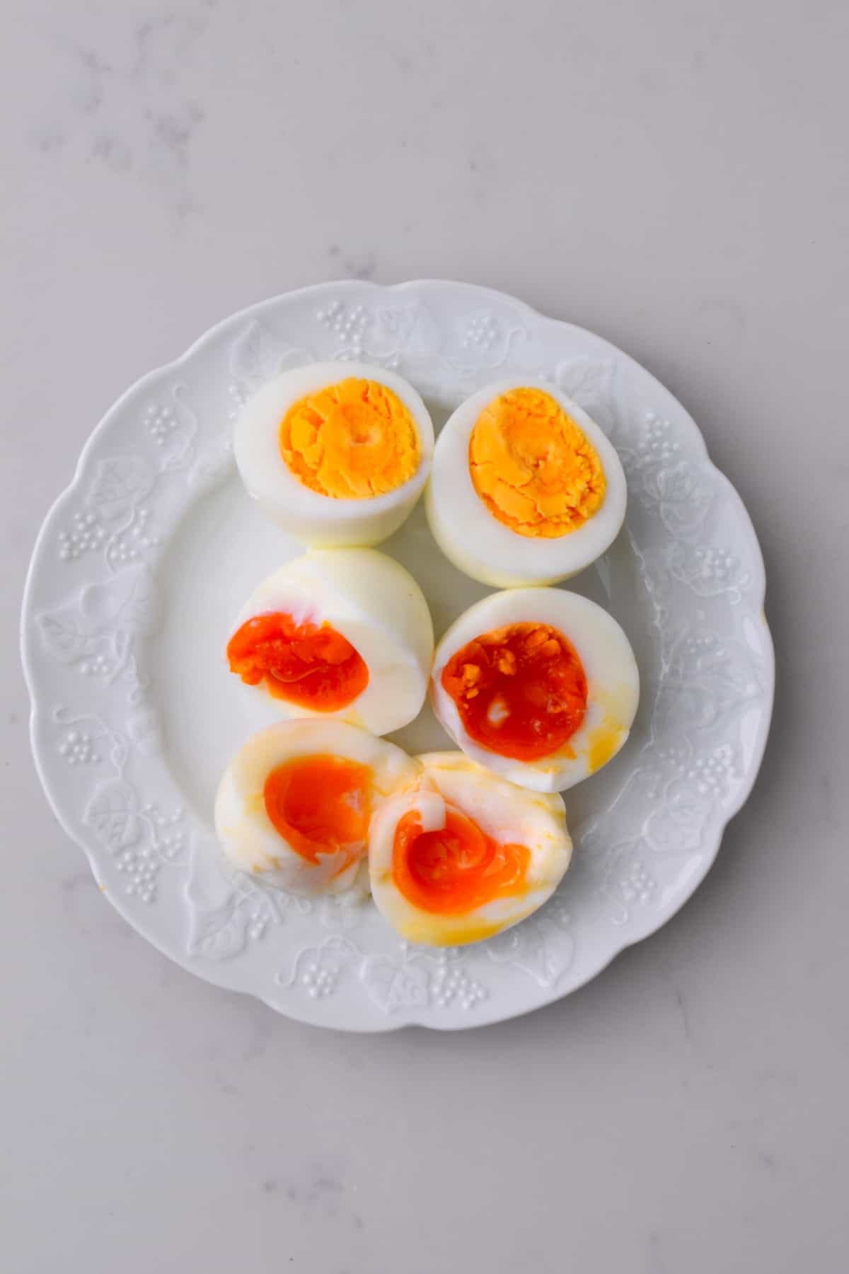 A plate with cooked eggs cut in half
