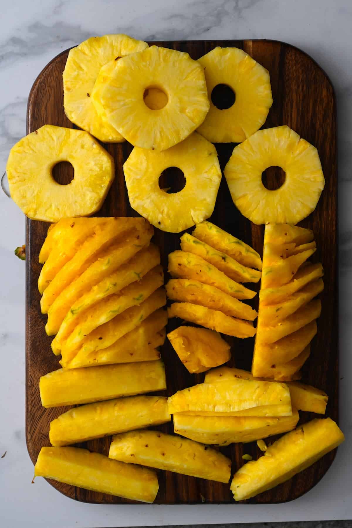 Pineapples cut into slices and rings