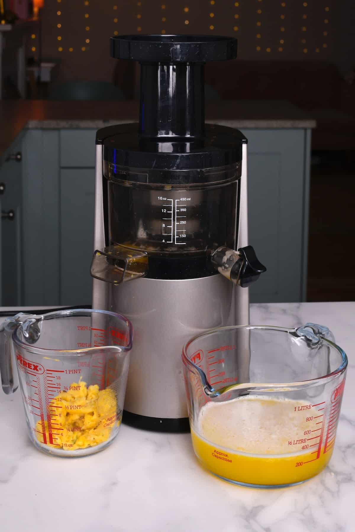 Juicing a pineapple with a juicerjpeg