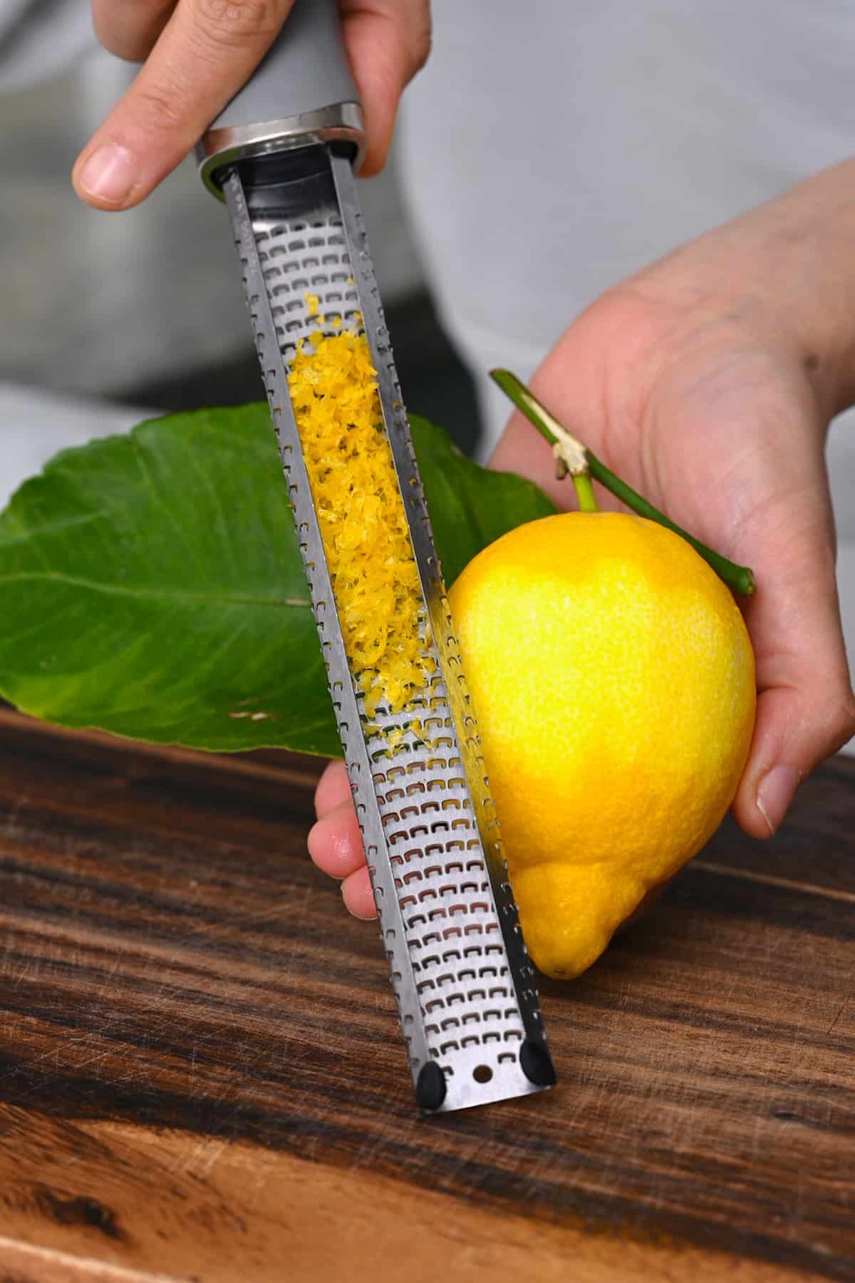 Zesting a lemon with a microplane