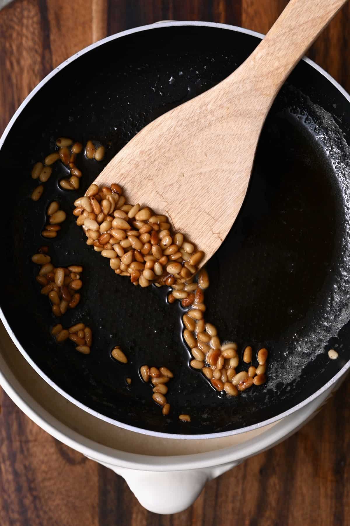 Toasted pine nuts in a pan