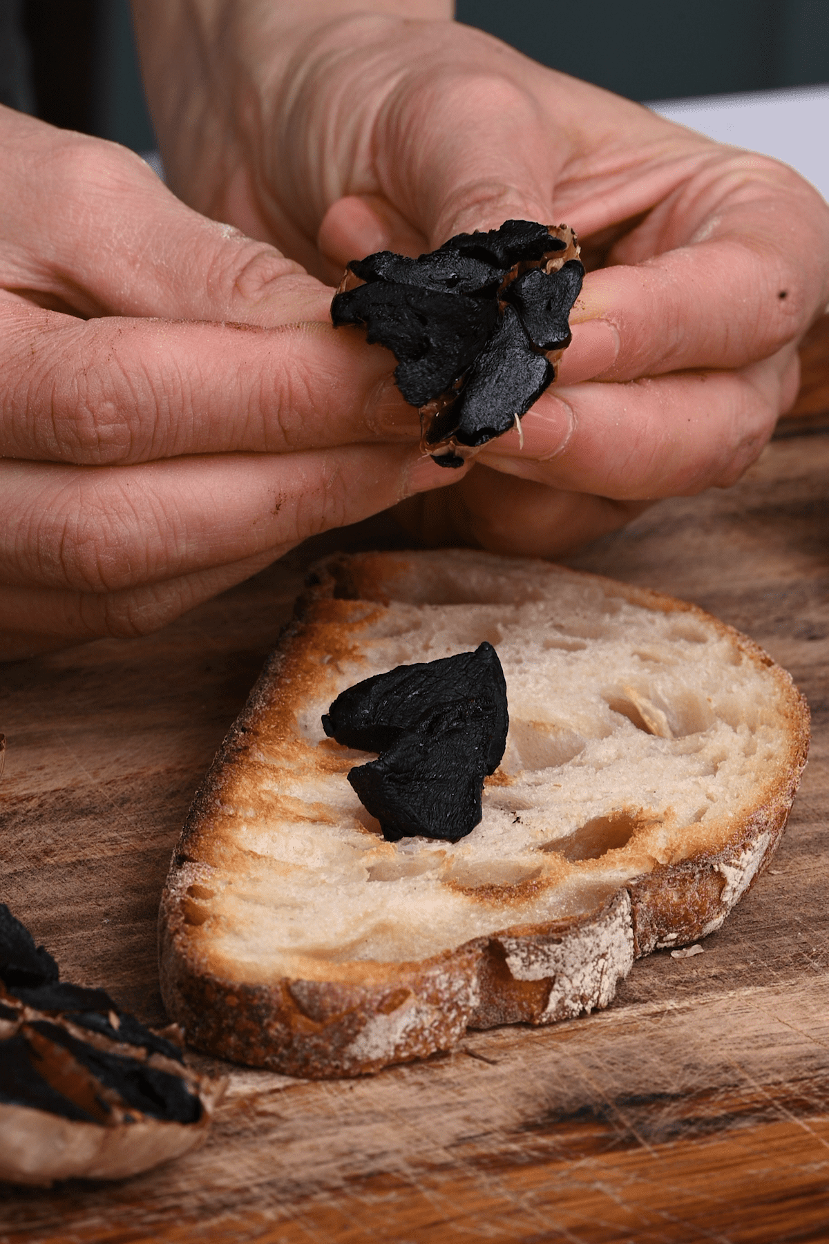 Spreading black garlic on toast